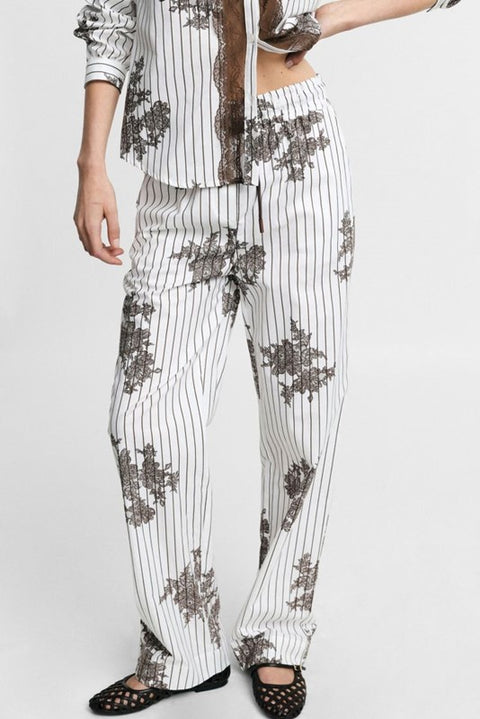 Pantaloni palazzo fantasia a righe con coulisse
