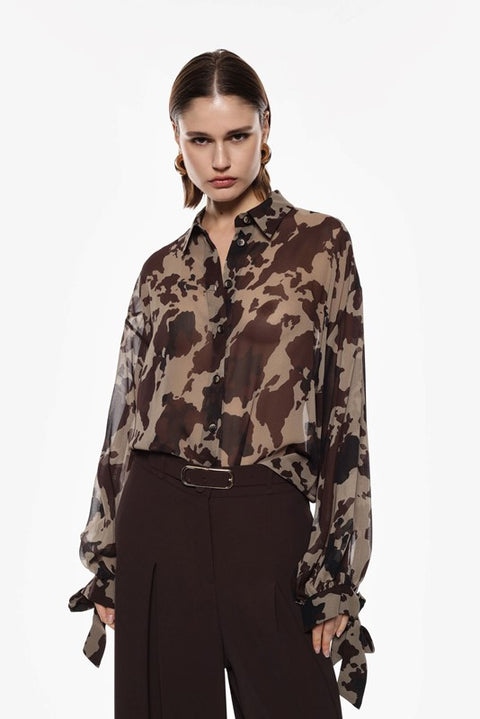 Blusa maculata con fiocco