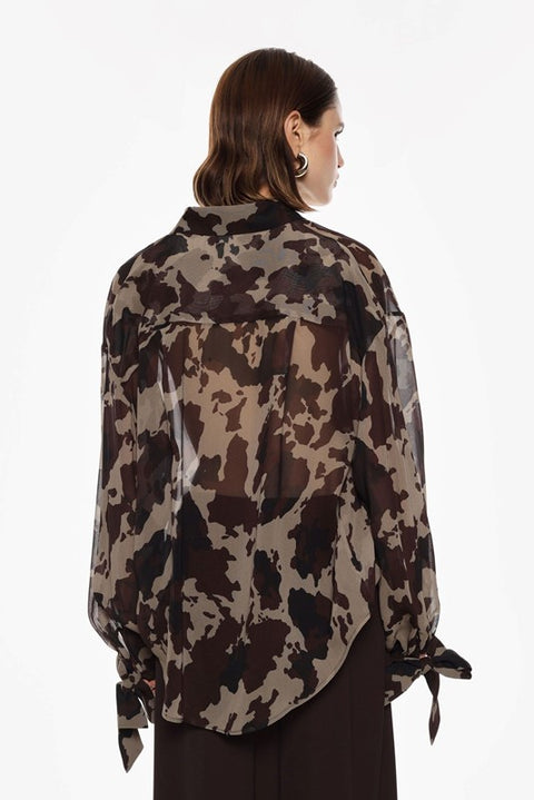 Blusa maculata con fiocco